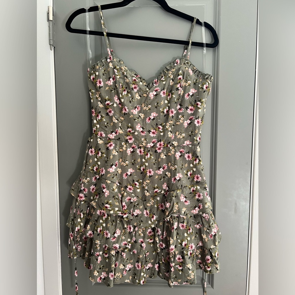 Green floral dress. Zip in the back. Tie waist. Size Small.